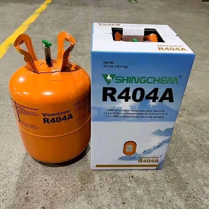R-404A refrigerant cylinder beside its 10.9 kg carton
